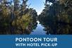 The bayou with a clear sky and a box saying "Pontoon Tour with Hotel Pick-Up" with Adventures of Jean Lafitte in New Orleans, Louisiana, USA.