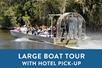 An air boat full of people and a blue box saying "Large Boat Tour with Hotel Pick-Up" with Airboat Adventures in New Orleans, Louisiana, USA.