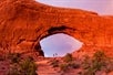 Some guests exploring this huge arche on the Arches National Park Sunset Discovery Tour Moab Utah.