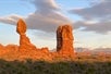 Some stunning rock formations against the mountainous background just before sundown on the Arches National Park Sunset Discovery Tour Moab Utah.