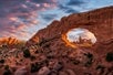 A view of the sky behind one of these incredible arches just at sundown on the Arches National Park Sunset Discovery Tour Moab Utah.