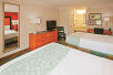 Two double beds, a flat-screen TV, work desk, mini-fridge and a microwave at Baymont Inn & Suites Chattanooga, TN.