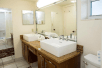 Fresh towels and bathroom amenities inside a private bathroom at Best Western Naples Inn & Suites, FL.