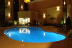 A large blue outdoor pool at Best Western Plus Casino Royale Center Strip. 