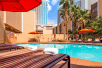 Outdoor pool with sun loungers at Best Western Plus Casino Royale Center Strip. 