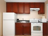 Kitchen, microwave, stovetop, refrigerator, sink at Best Western St. Augustine Beach Inn, FL.