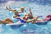 A family enjoying the Lazy River at Big Kahuna's Water and Adventure Park in Destin, Fl. USA.