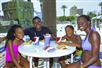 A family enjoying lunch in the shade at Big Kahuna's Water and Adventure Park in Destin, Fl. USA.