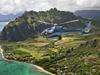 Experience the “other Oahu”: A Blue Hawaiian Eco-Star glides by awesome Pu’u Kanehoalani; in the distance is Mokoli‘i Island (“Chinaman’s Hat”), Windward Oahu’s legendary landmark.