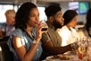 Guests drinking wine and enjoying their meal 