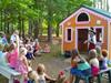 Witch entertains kids at Enchanted Storybook Forest
