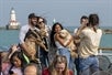 Tour group and their dogs taking photos on the Canine Cruise in Chicago Illinois.