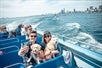 Some guests with their dogs and Chicago in the background on the Canine Cruise in Chicago Illinois.