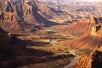 A river running through the Canyonlands near sunset on the Canyonlands National Park Airplane Tour in Moab Utah, USA.