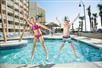 Kids Jumping by the Pool - Captains Quarters in Myrtle Beach, South Carolina