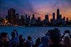 The sunset behind Chicago as seen on the Chicago by Night Cruise in Chicago Illinois.