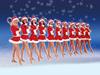 Dancers in red and white hold a candy cane prop