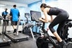 Fitness Center featuring Peloton Bike and treadmills.