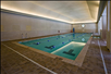 Cozy indoor pool with clear and calm water.