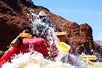 The back of a raft as it splashes through the rapids on the Colorado River Full-Day Rafting Adventure in Moab Utah.