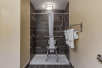 Accessible shower in a guest room at Comfort Inn at the Park in Fort Mill, SC.