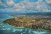 Diamond Head seen from over the ocean on the Complete Island Oahu Helicopter Tour in Hawaii USA.