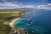 A helicopter flying above Oahu's coastline on the Complete Island Oahu Helicopter Tour in Hawaii USA.