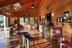 The interior of the Lumos Wine Co. with lots of barrels and seating options near Seattle, Washington.