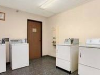 Laundry room with washing machines.
