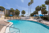 Outdoor pool at Days Inn by Wyndham Cocoa Beach Port Canaveral.