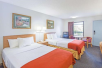 2 Double Beds at Days Inn by Wyndham Valdosta at Rainwater Conference Center.
