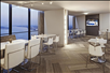 Dining area inside the Concierge Lounge with view of Detroit River.