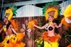 Colorful Polynesian inspired costumes performing all out their remarkable hula dance.