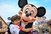 Mickey Mouse gets a hug from a young guest at Walt Disney World® Resort's Magic Kingdom® Park in Orlando, Florida