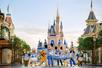 Disney characters lined up in front of Cinderella's Castle in their 50th Anniversary costumes at Walt Disney World in Orlando, Florida, USA.