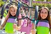 Two young girls smiling while riding the Linus Launcher at Dorney Park in Allentown, Pennsylvania.
