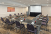 Meeting facility with tables and chairs.
