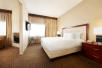 Guest room with one king bed at DoubleTree Suites by Hilton Hotel Cincinnati - Blue Ash, OH.