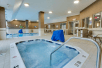 Indoor pool and a hot tub at Drury Inn & Suites Charlotte Arrowood.
