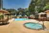 Outdoor pool and jacuzzi at Drury Plaza Hotel San Antonio Airport.