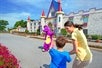 A mother and son are filled with excitement as they meet the mascot, Duke the Dragon, while making their way to the majestic castle of Dutch Wonderland.