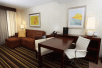 Living area with sofa bed and work desk at Embassy Suites by Hilton Savannah Airport, Savannah, GA.