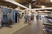 Fitness center with a variety of exercise equipment.