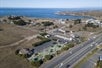 Aerial view of the Emerald Inn in Fort Bragg, California and California Coast in the background.