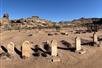 Several old tombstones with mounds of dirt behind them on a sunny day on the Exclusive Access Zion Jeep Tour and Grafton Ghost Town Experience.