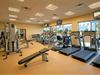 Fitness center with weights and cardio equipment.