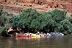 Oar rafts and tour guides on stand by while waiting for the guests.