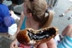 A close up of the deep fried oreo this guest is eating at one of the stops on the Food on Foot Midtown Mix Guided NYC Tour New York CIty, New York.
