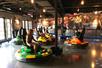 Several people in spinning bumper cars having a good time at the Spin Zone at Fun Mountain at Big Cedar Lodge.