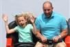 Dad and daughter on a roller coaster ride at Fun Spot